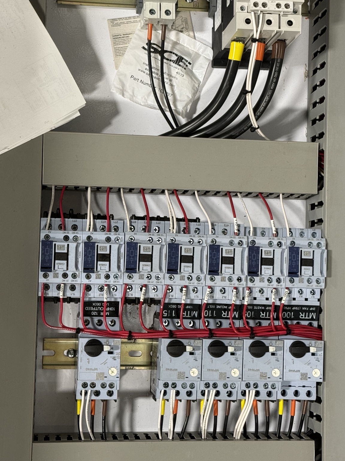 Wiring, contactors and motor protection devices inside a control cabinet