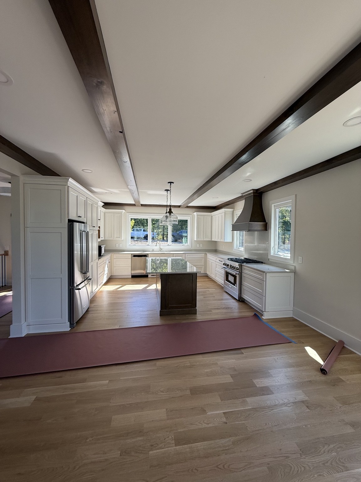 Kitchen recessed lighting and pendant fixture with exposed beams