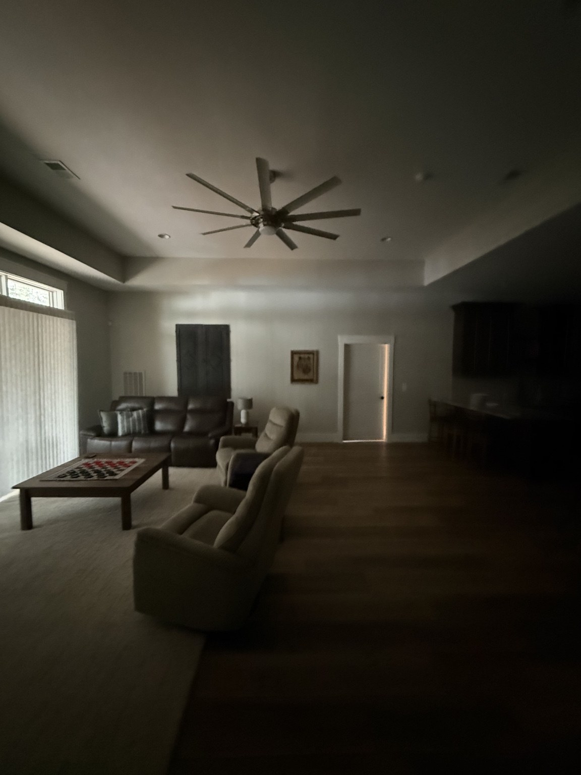 Ceiling fan and recessed lighting in a furnished living room